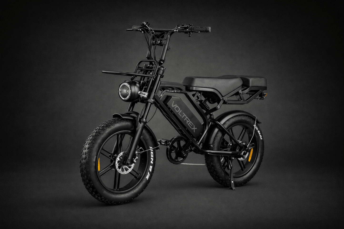 VOLTREX GRID electric bike with dual suspension, fat off-road tires, and front basket for practical everyday riding and commuting