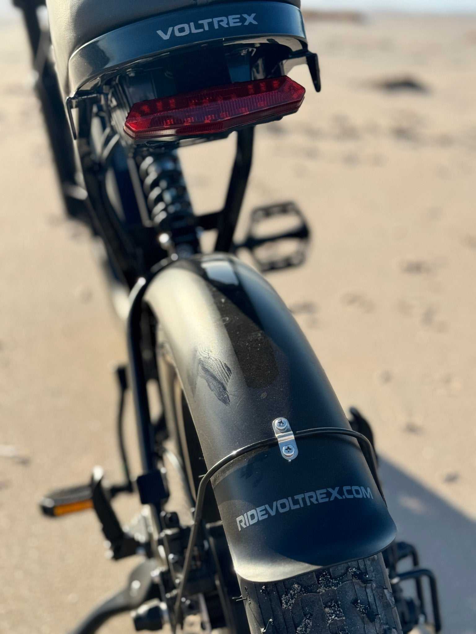 VOLTREX GRID utility electric bike with dual suspension and fat off-road tires for versatile commuting and cruising