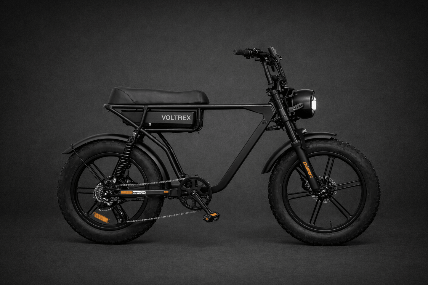 VOLTREX TORQ 1000 fat tyre electric bike with 1000W motor, dual suspension, hydraulic brakes, and rear cargo basket.
