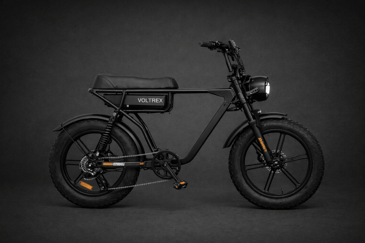 VOLTREX TORQ 1000 fat tyre electric bike with 1000W motor, dual suspension, hydraulic brakes, and rear cargo basket.